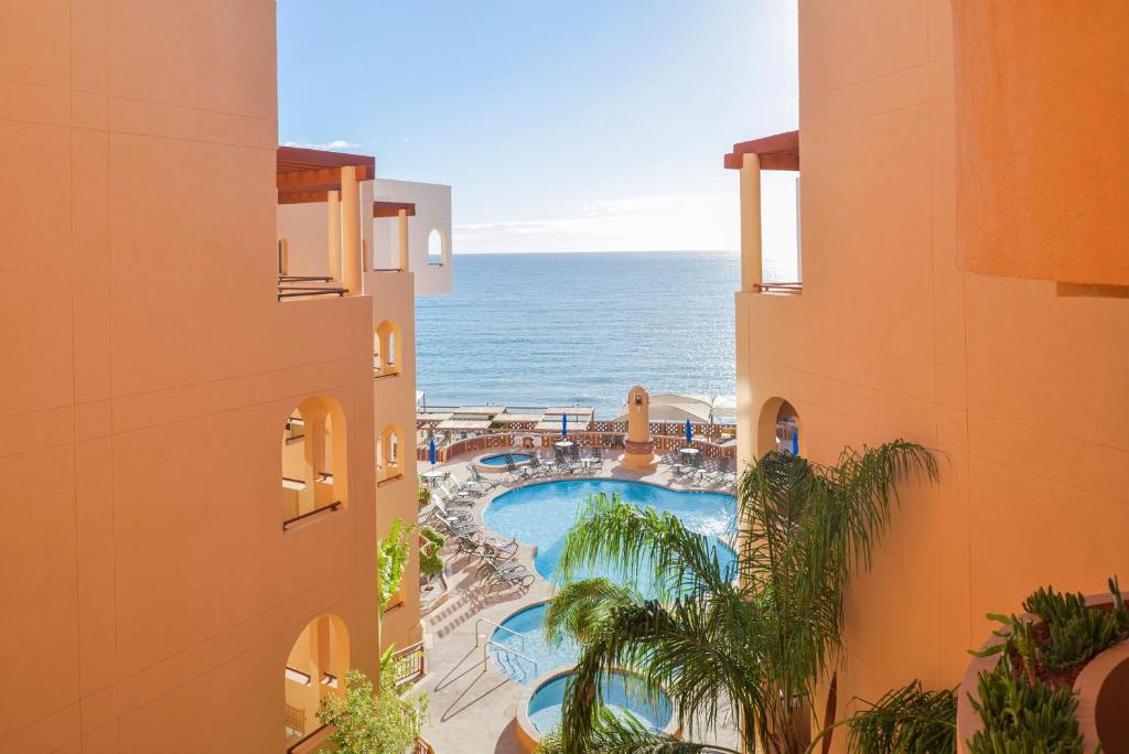 an aerial view of a resort with a swimming pool and the ocean at Sea of Cortez Beach Club in San Carlos