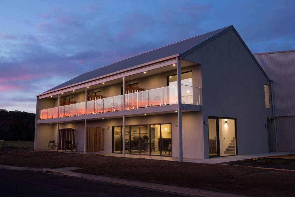 a building with a balcony on the side of it at The Seabird in Moruya