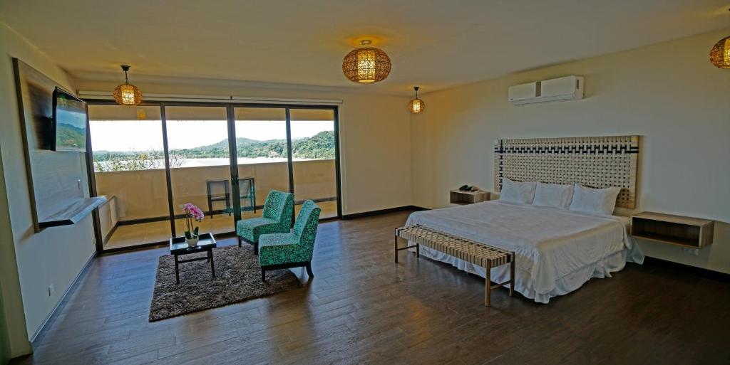 Postel nebo postele na pokoji v ubytování Nammbú Beach Front Bungalows