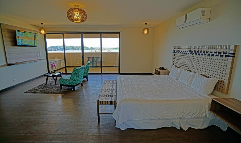 Postel nebo postele na pokoji v ubytování Nammbú Beach Front Bungalows