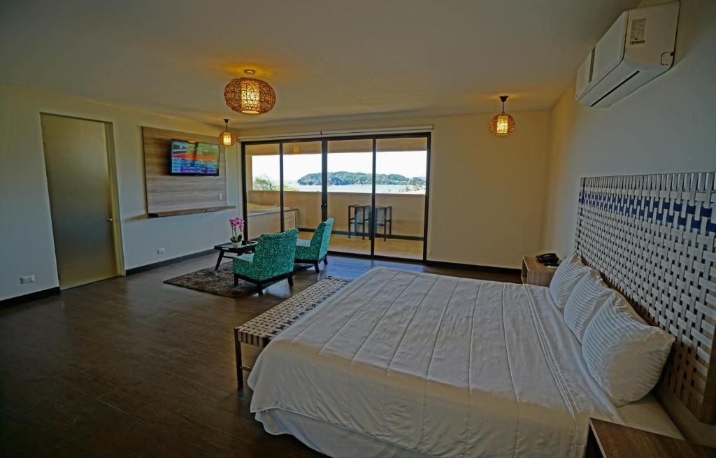 Postel nebo postele na pokoji v ubytování Nammbú Beach Front Bungalows
