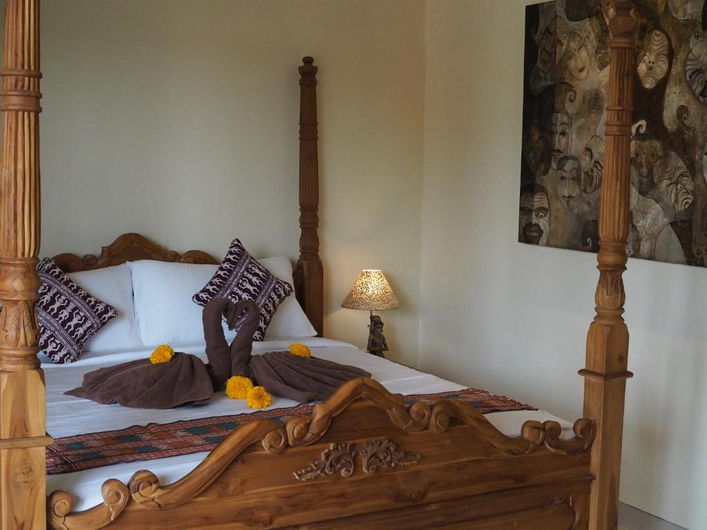 Postel nebo postele na pokoji v ubytování Kampung Sari Homestay