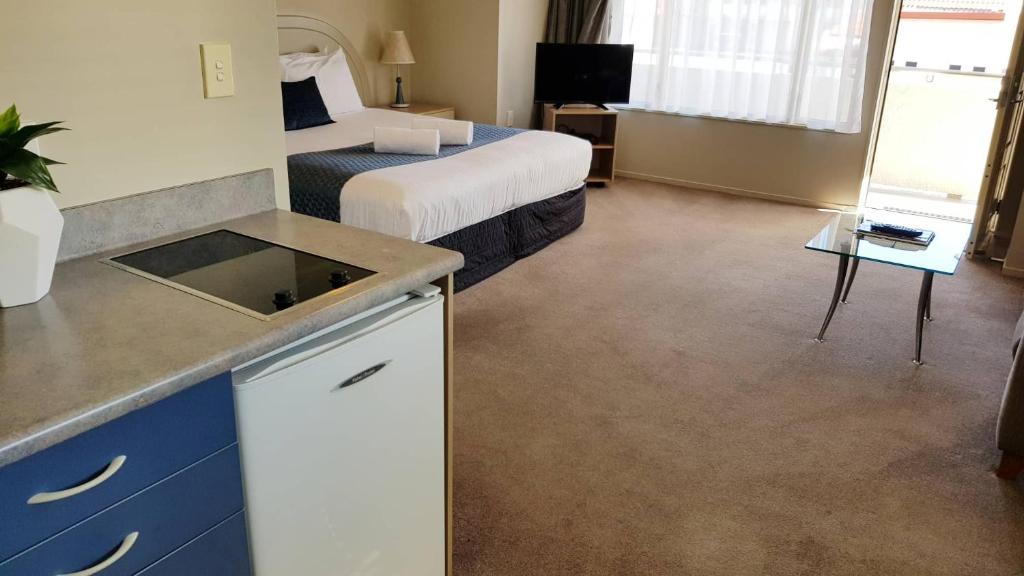Postel nebo postele na pokoji v ubytování Brougham Heights Motel
