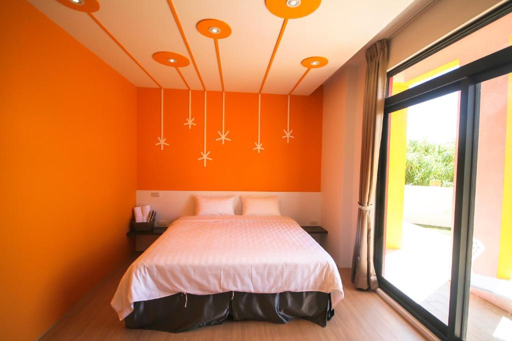 Postel nebo postele na pokoji v ubytování Colorful Homestay
