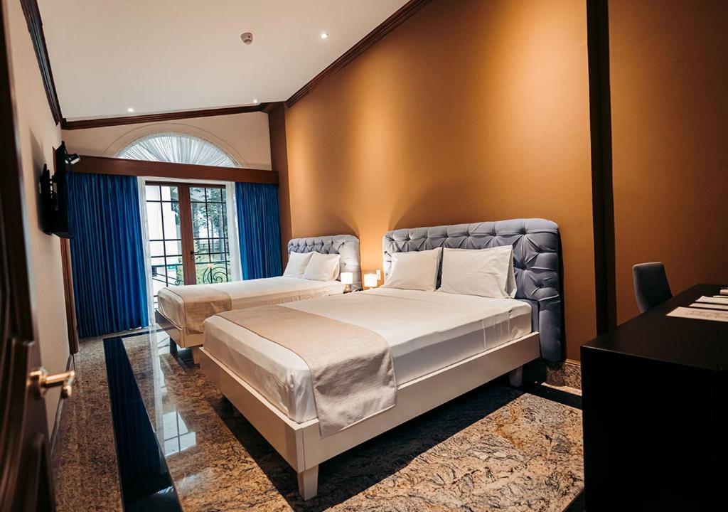 Postel nebo postele na pokoji v ubytování Luxva Hotel Boutique