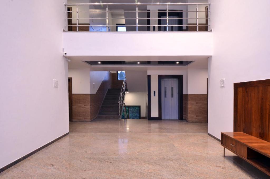 an empty hallway with a staircase in a building at HOTEL DWARKA PARK in Shirdi