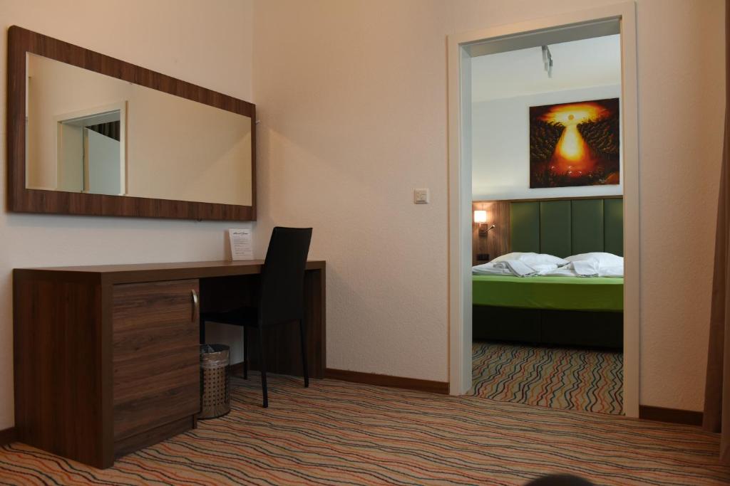 Postel nebo postele na pokoji v ubytování Hotel Olive Inn