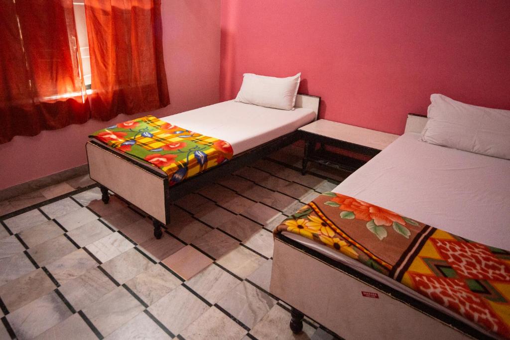 Postel nebo postele na pokoji v ubytování Hotel Everest