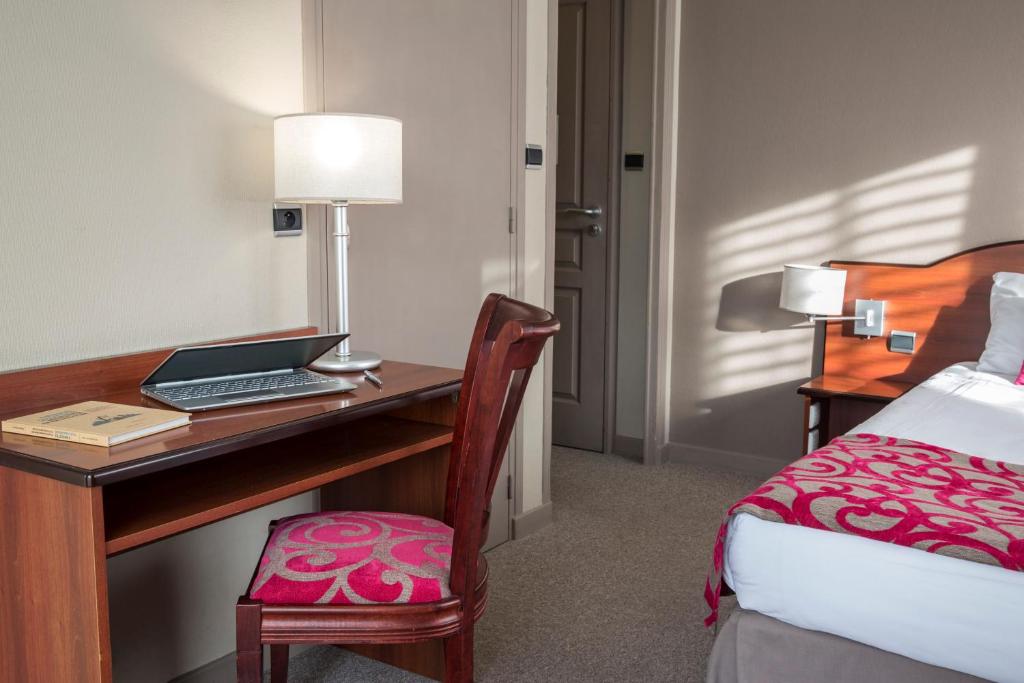 Postel nebo postele na pokoji v ubytování Hotel Les Mésanges