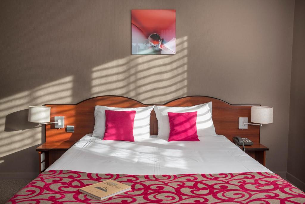 Postel nebo postele na pokoji v ubytování Hotel Les Mésanges
