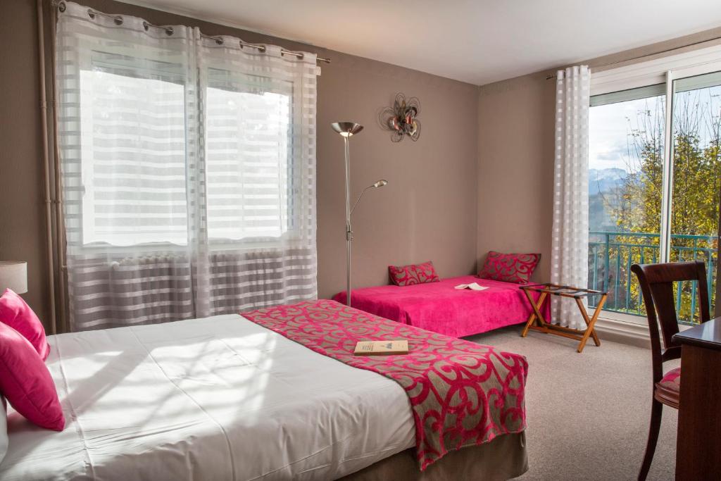 Postel nebo postele na pokoji v ubytování Hotel Les Mésanges