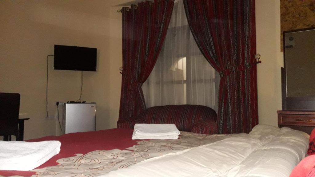 Postel nebo postele na pokoji v ubytování Ahlam Musandam Villa