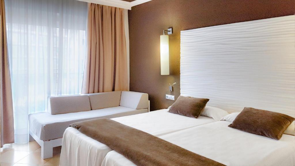 Postel nebo postele na pokoji v ubytování Hotel Augustus