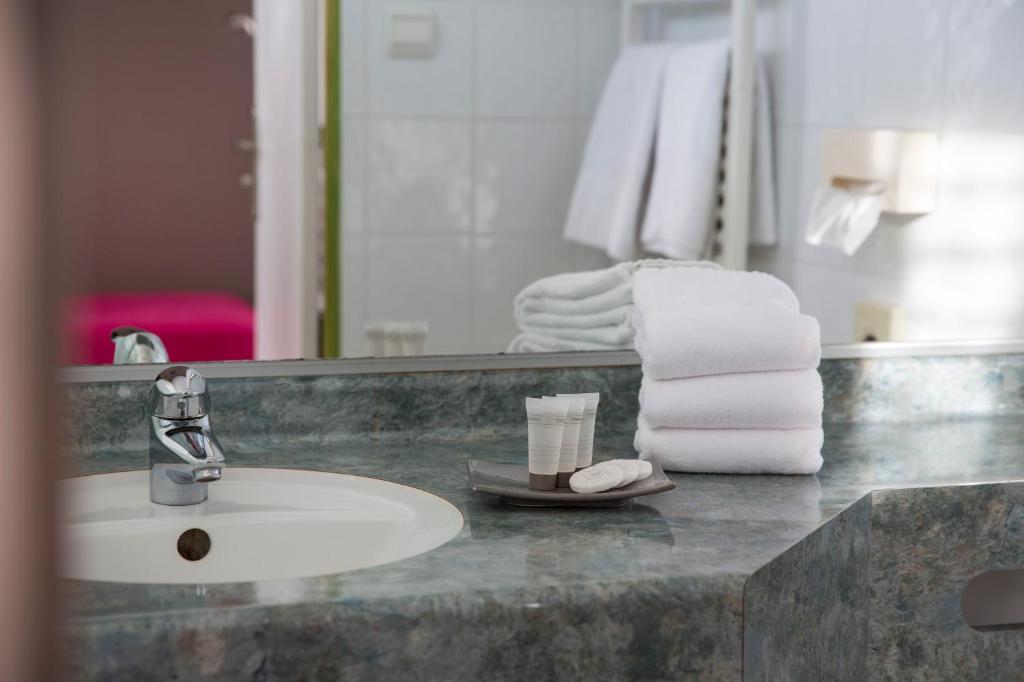 Koupelna v ubytování Hotel Les Mésanges