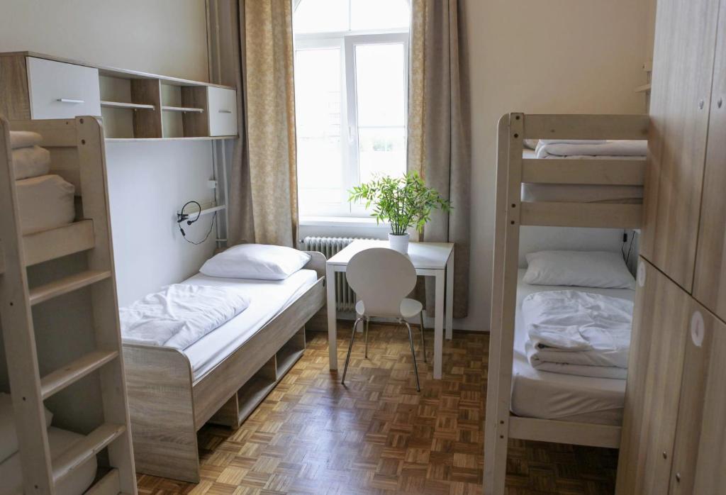 Postel nebo postele na pokoji v ubytování C - Punkt Hostel