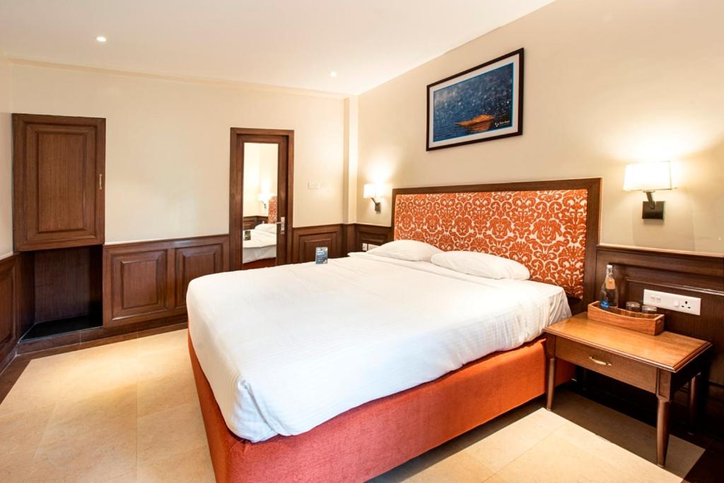 Postel nebo postele na pokoji v ubytování Hotel Raindrops