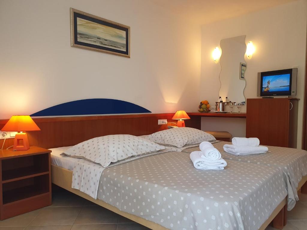Postel nebo postele na pokoji v ubytování Tourist Settlement Brzet