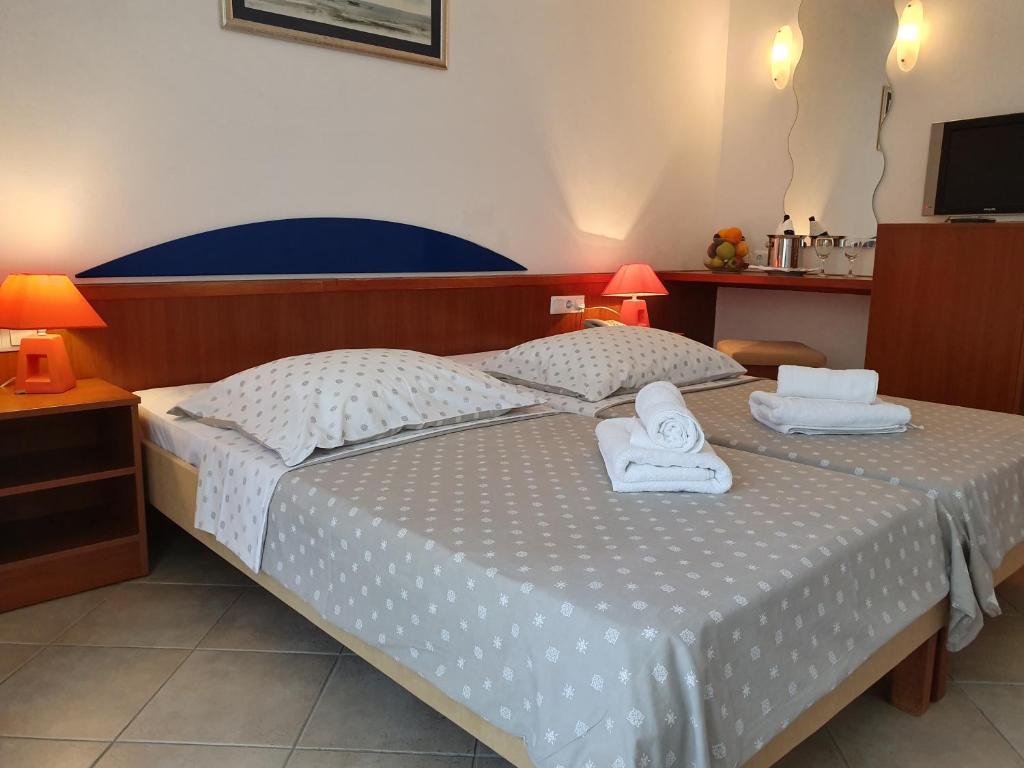 Postel nebo postele na pokoji v ubytování Tourist Settlement Brzet