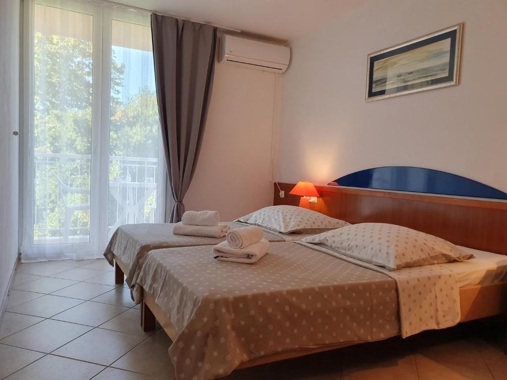 Postel nebo postele na pokoji v ubytování Tourist Settlement Brzet