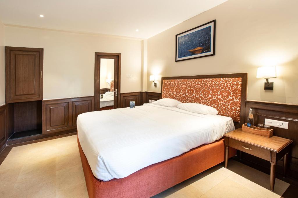 Postel nebo postele na pokoji v ubytování Hotel Raindrops