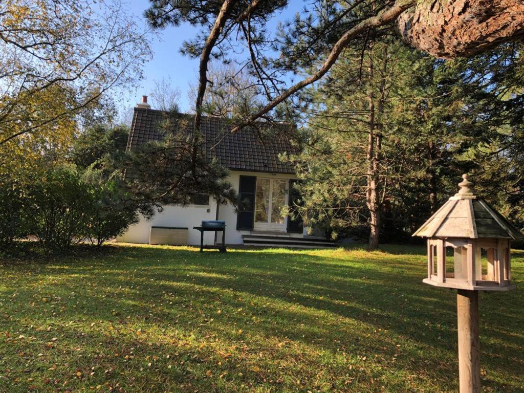 a house with a bird house in the yard at La Source in Condette