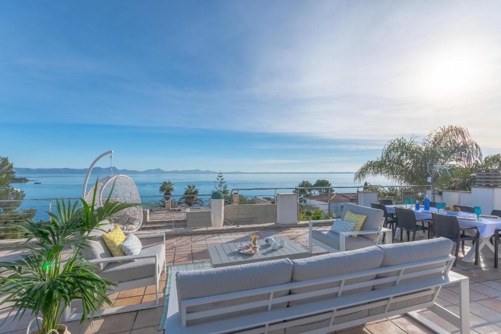 a view of the ocean from the balcony of a house at YupiHome Villa Alcanada Lighthouse in Alcanada