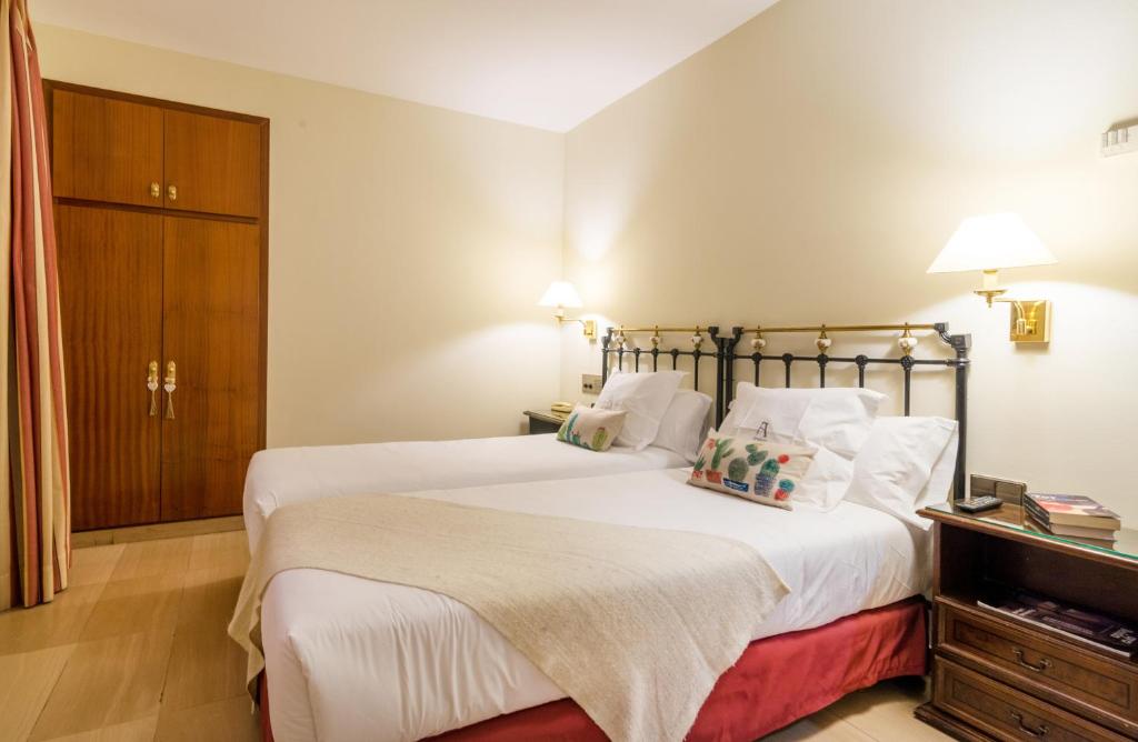 Postel nebo postele na pokoji v ubytování Hotel Andria