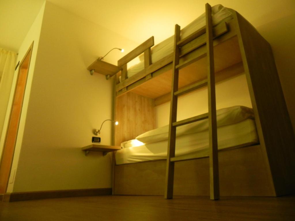 Postel nebo postele na pokoji v ubytování Rifugio Capanna Bill