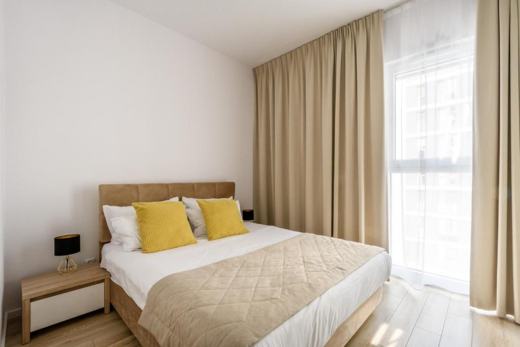 Postel nebo postele na pokoji v ubytování Varsovia Apartamenty Kasprzaka