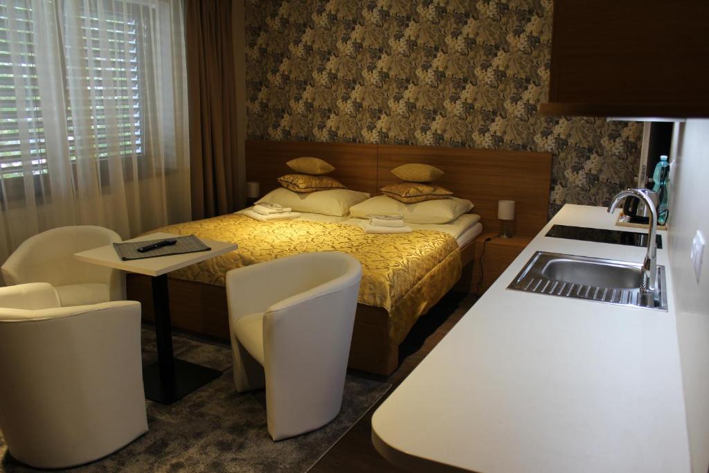 Łóżko lub łóżka w pokoju w obiekcie Apartments 461