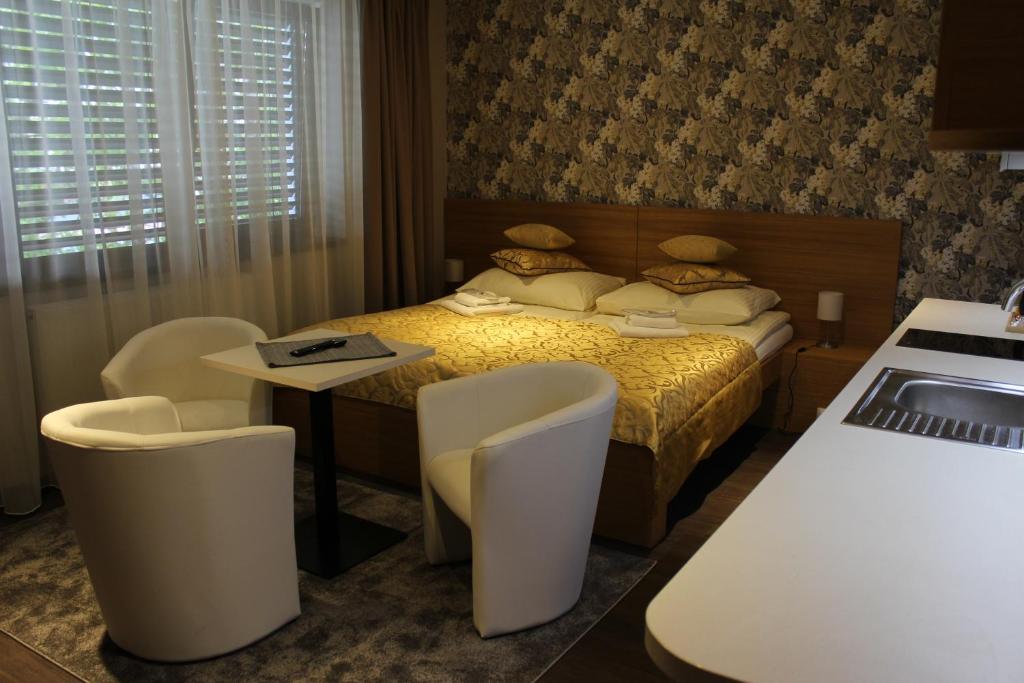 Łóżko lub łóżka w pokoju w obiekcie Apartments 461