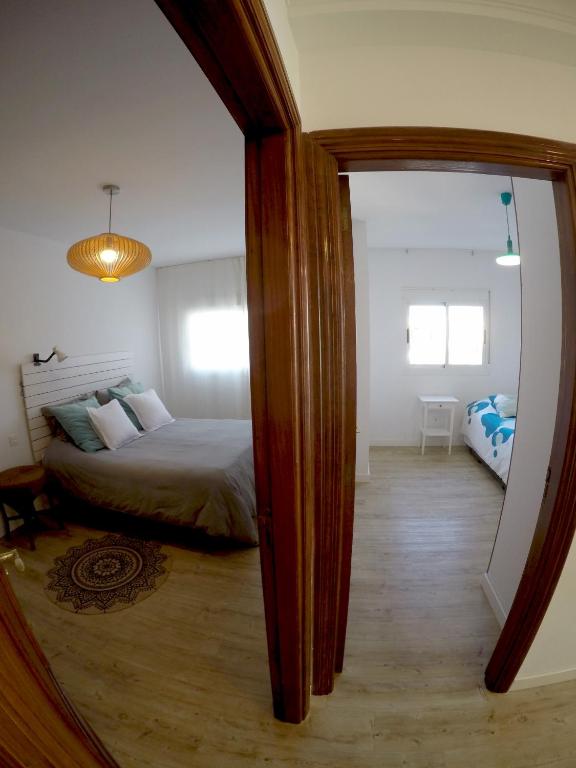 A bed or beds in a room at Casa Capricho
