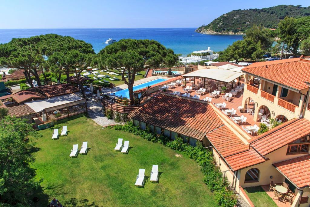 an aerial view of a resort with a swimming pool at Hotel Biodola in Portoferraio