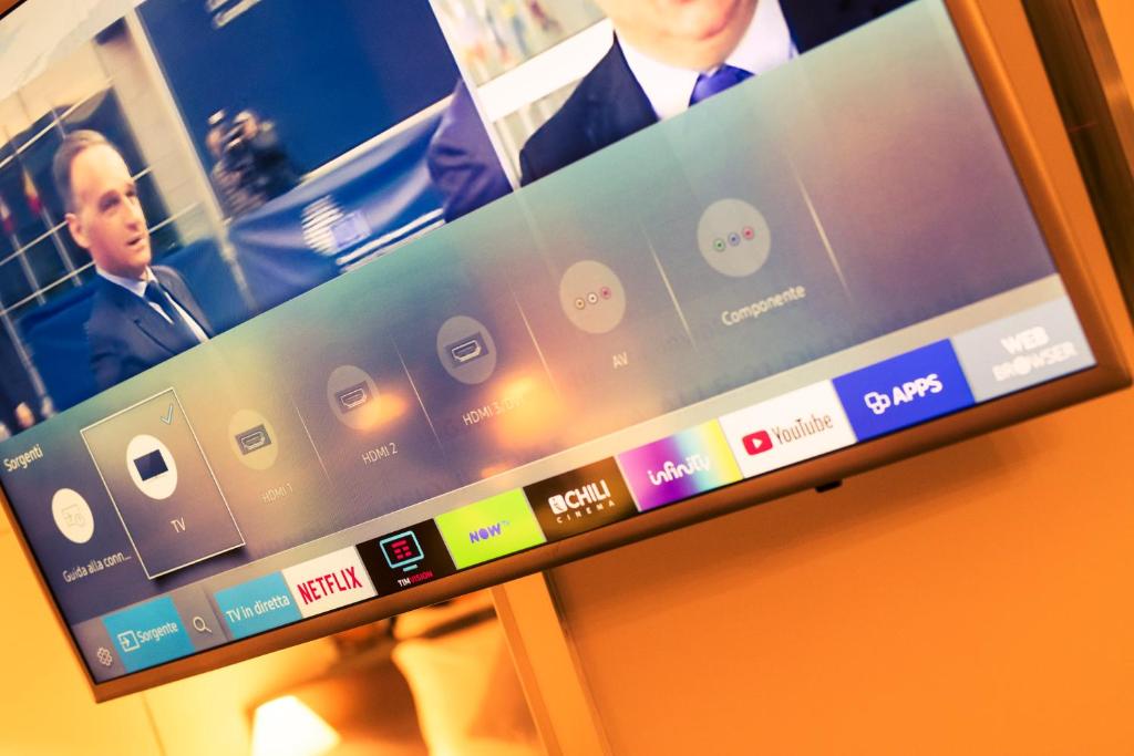 TV a/nebo společenská místnost v ubytování AS Hotel Sempione Fiera