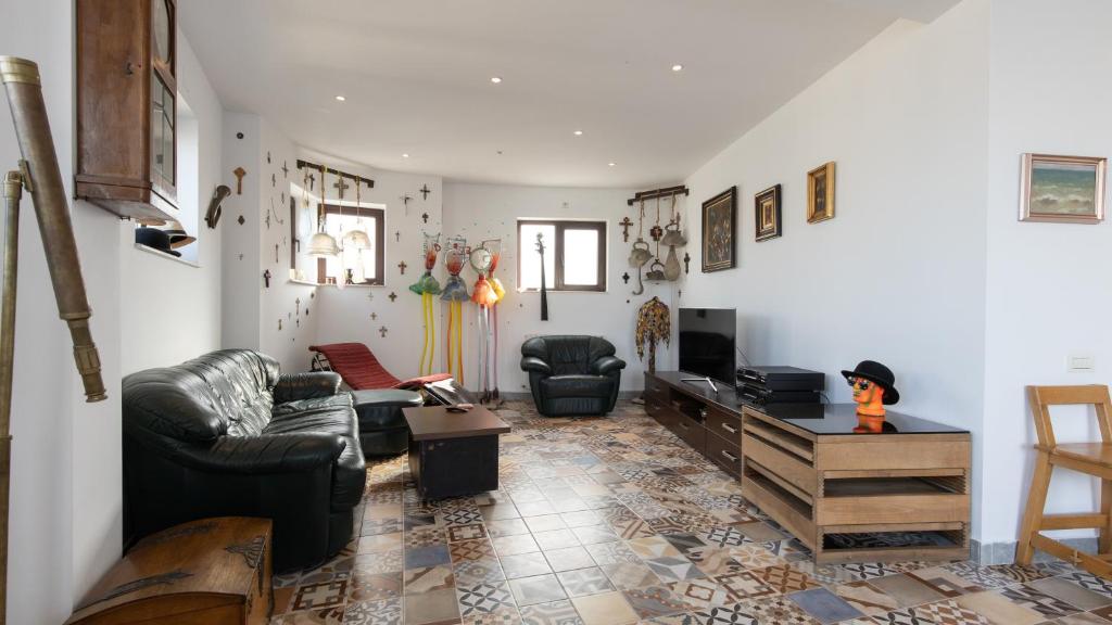 a living room with a couch and a table at Great Black Sea View in Constanţa