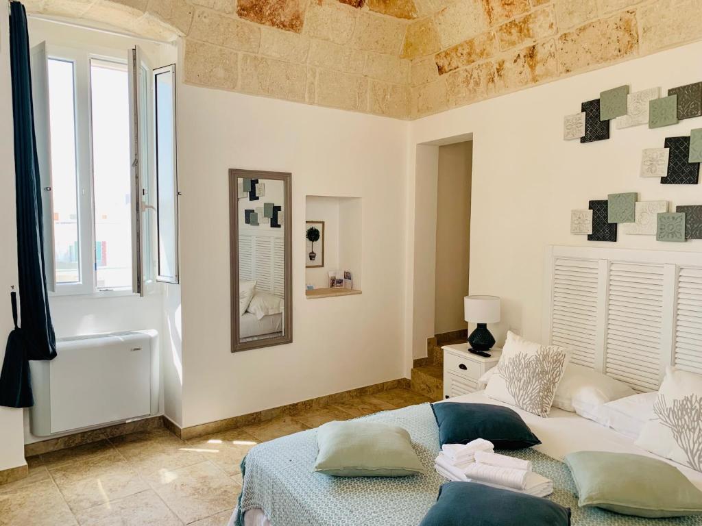 Postel nebo postele na pokoji v ubytování POSEA - Polignano Sea Suites