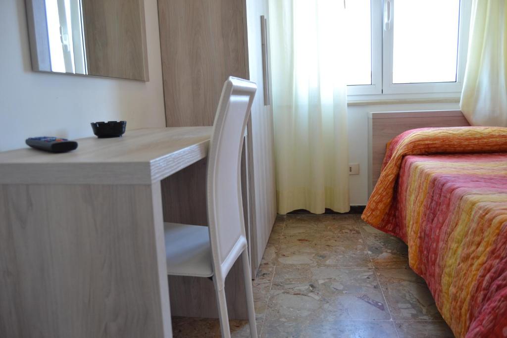 Postel nebo postele na pokoji v ubytování Hotel Apis