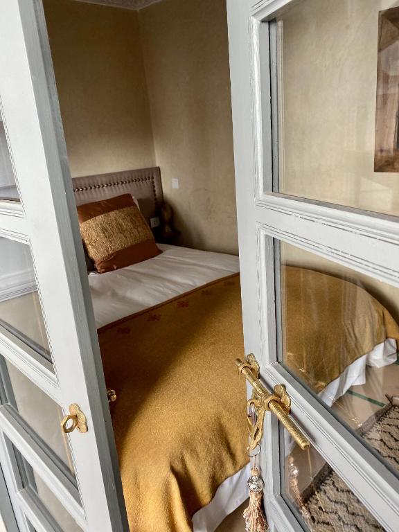 Postel nebo postele na pokoji v ubytování Riad Hadika Maria