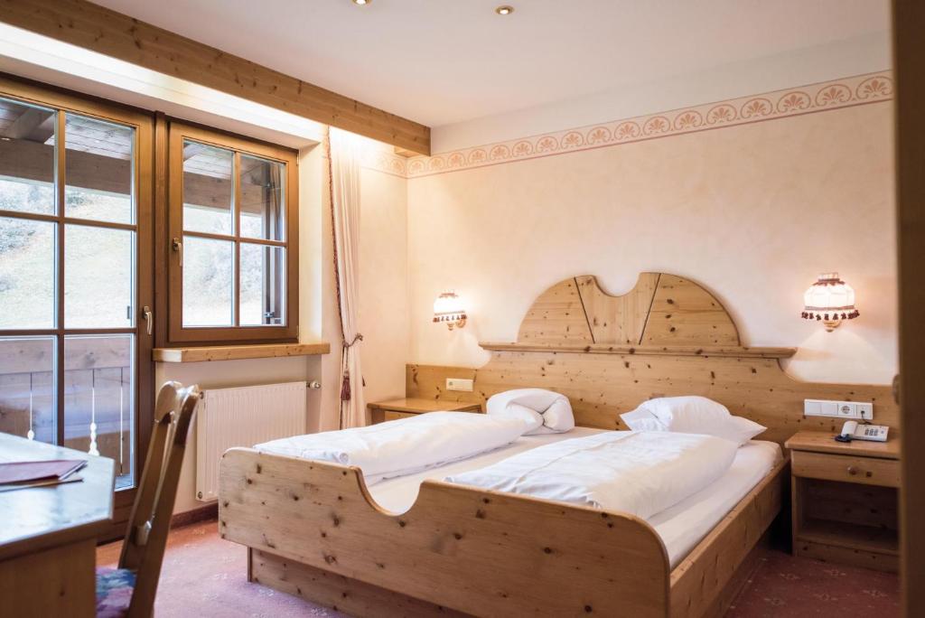 Postel nebo postele na pokoji v ubytování Hotel Edelweiss