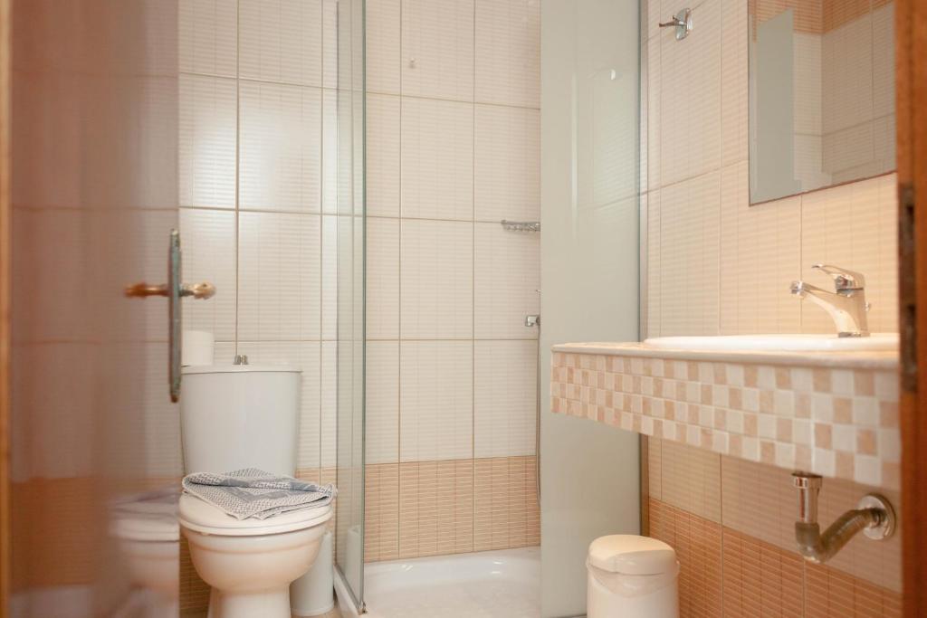 Koupelna v ubytování Vournelis Hotel