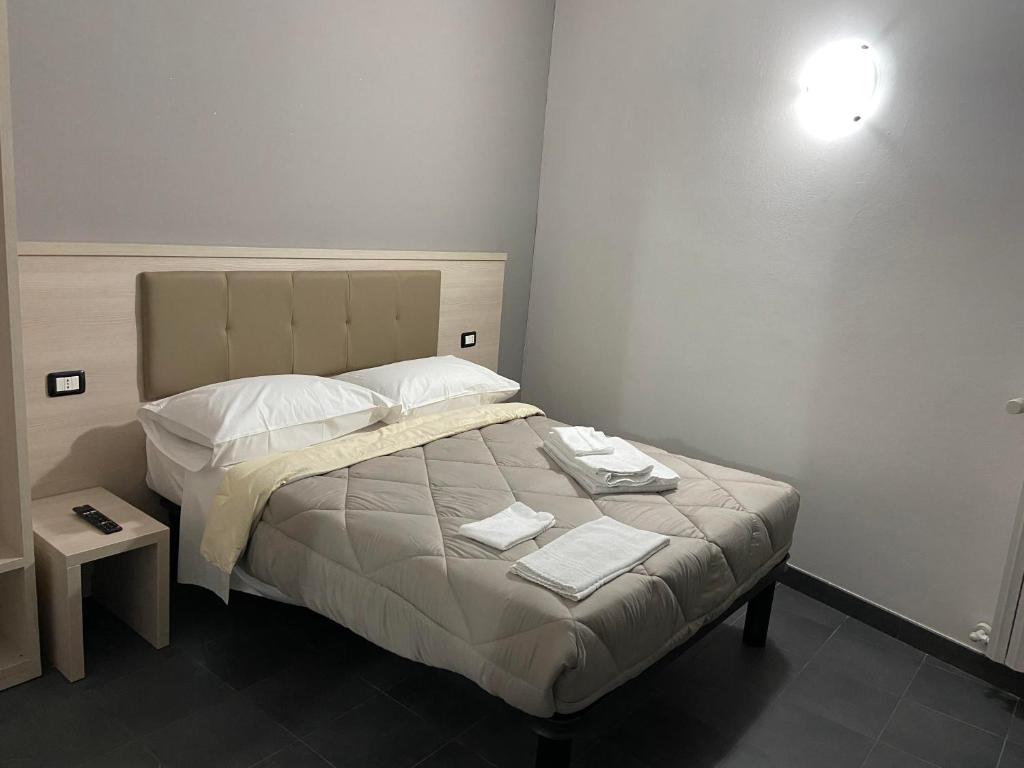 A bed or beds in a room at BICOCCA APPARTAMENTI