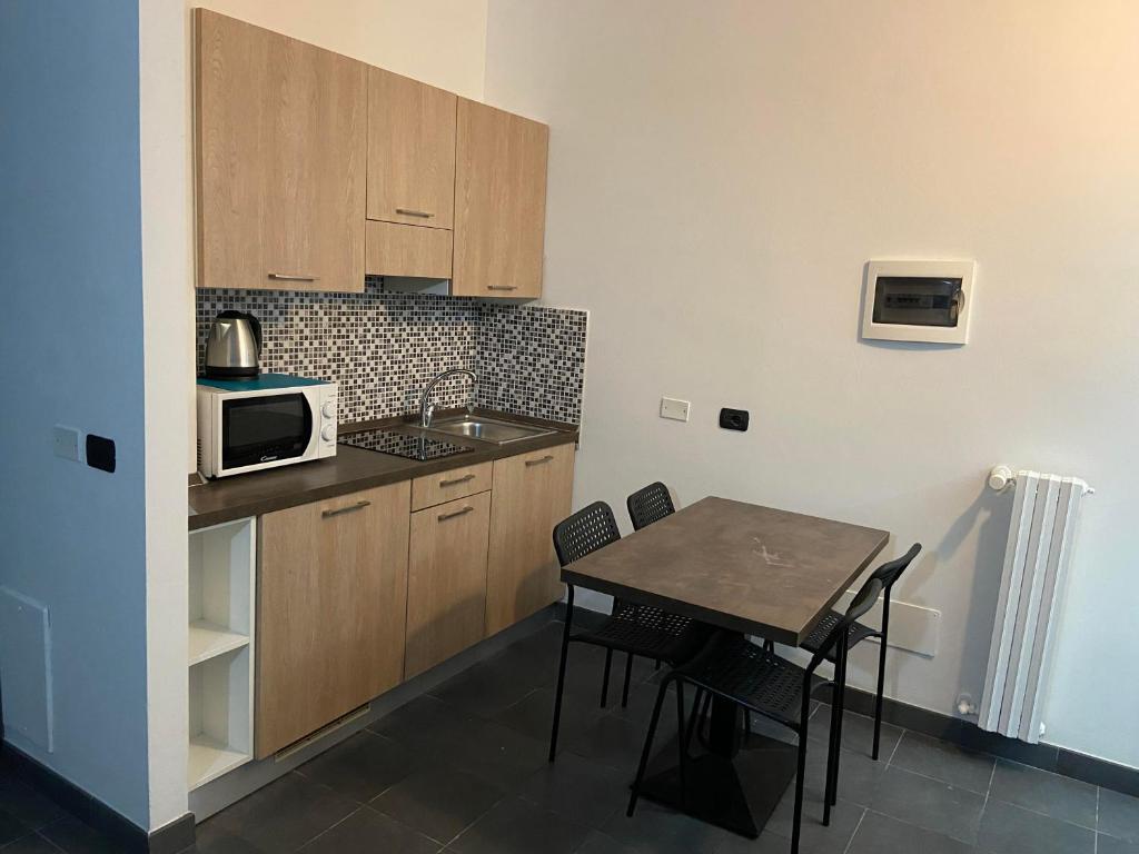 A kitchen or kitchenette at BICOCCA APPARTAMENTI