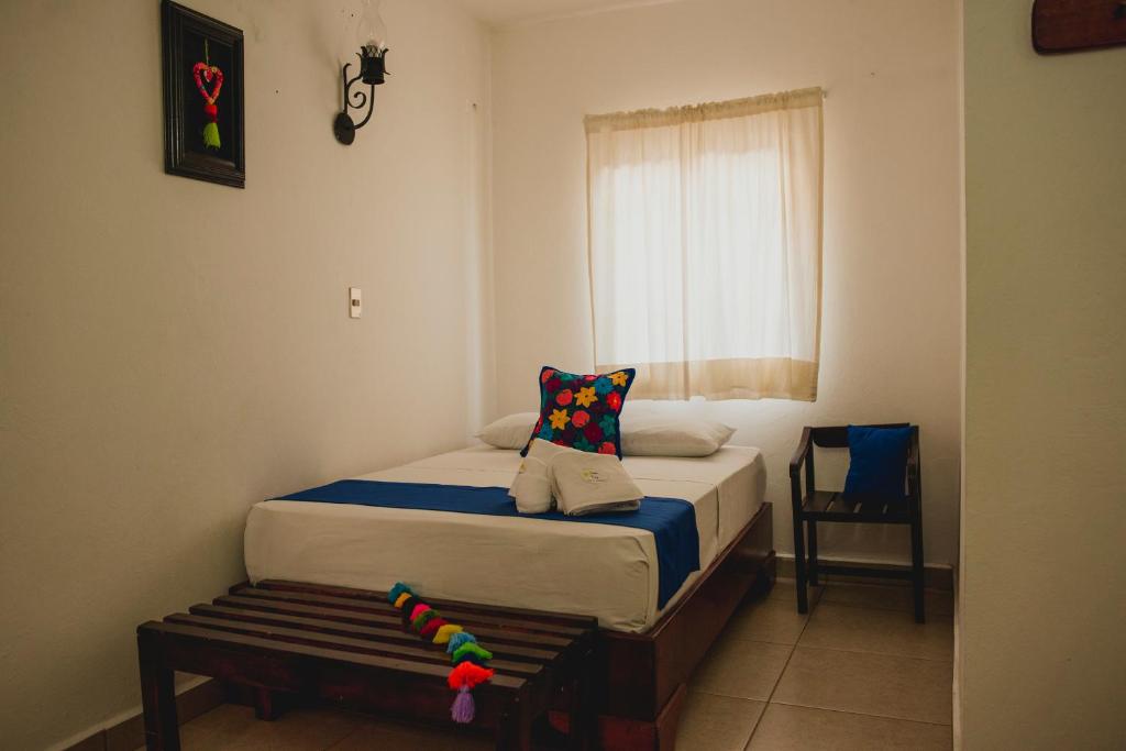 Postel nebo postele na pokoji v ubytování Posada Kin