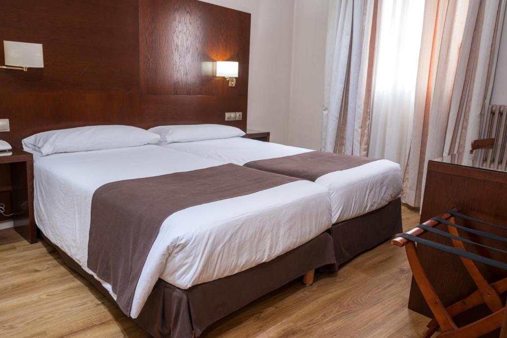 Een bed of bedden in een kamer bij Ramon Berenguer IV