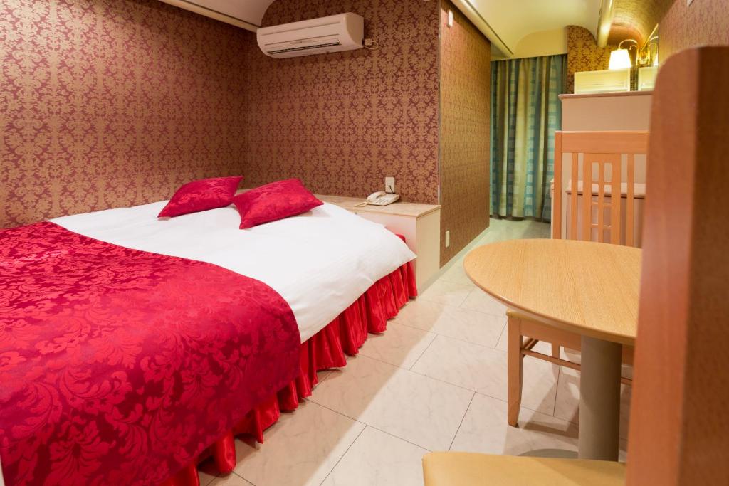 Postel nebo postele na pokoji v ubytování Hotel Route One