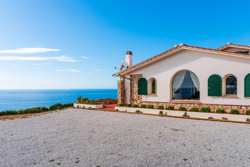 a house with a view of the ocean at Villa Glaucos in Capoliveri