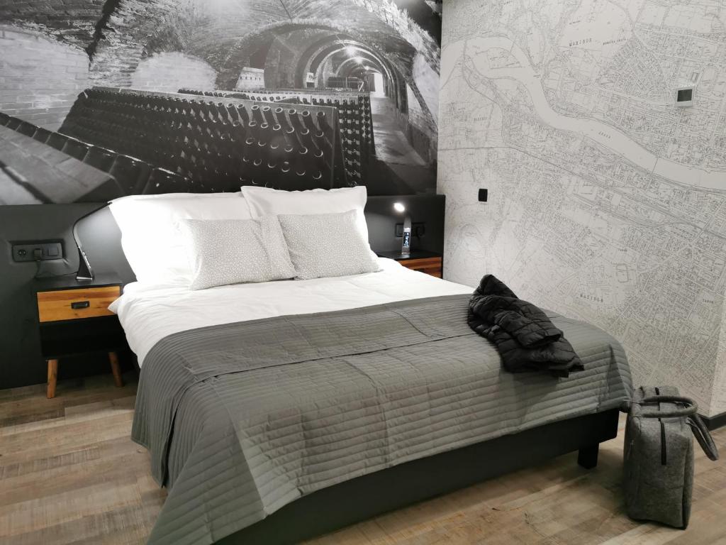 Postel nebo postele na pokoji v ubytování Hotel CityMap Maribor