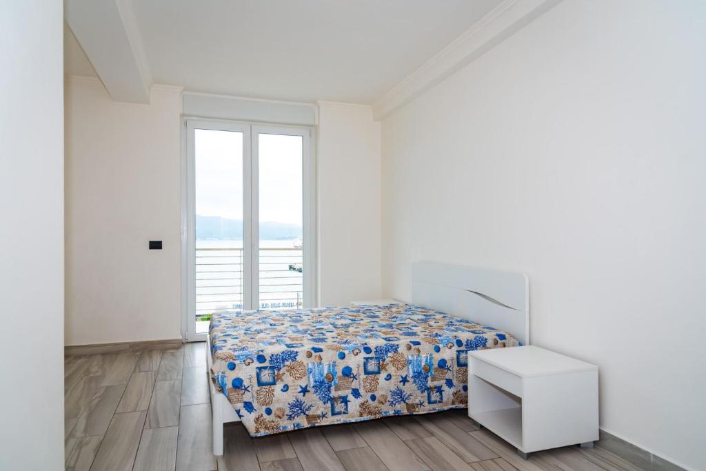 Postel nebo postele na pokoji v ubytování Appartamento Fronte Mare