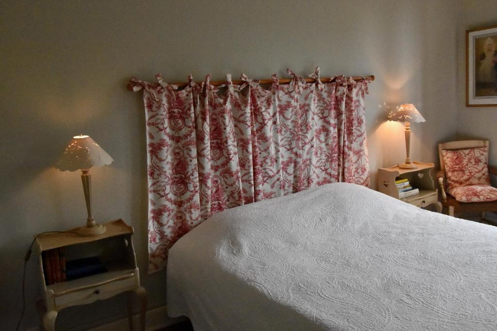 Letto o letti in una camera di Residence le Petit Paradis