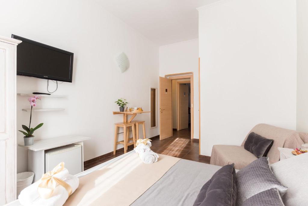 TV a/nebo společenská místnost v ubytování Domus Victoria Guest House